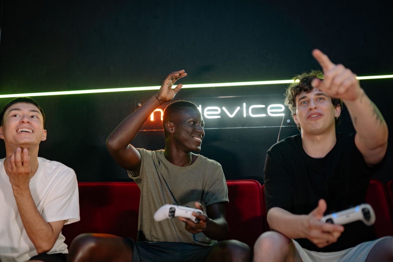 The Art of Drawing Readers In: Your attractive post title goes here Three young men enthusiastically playing video games together, using wireless controllers indoors.